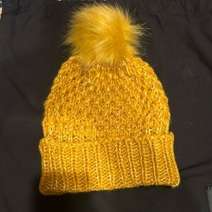 Steve Madden Golden knit beanie with faux fur Pom Pom.